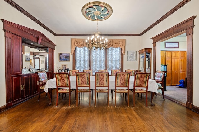 1020 New Mcneil Ave, Lawrence, NY 11559 - dining room with a chandelier, wood finished floors, and crown molding
