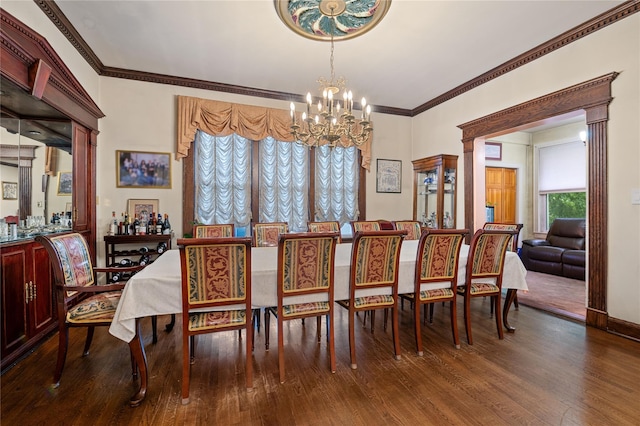 1020 New Mcneil Ave, Lawrence, NY 11559 - dining space featuring a chandelier, wood finished floors, and crown molding