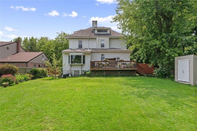1020 New Mcneil Ave, Lawrence, NY 11559 - back of house featuring a deck, a yard, a shed, and roof with shingles