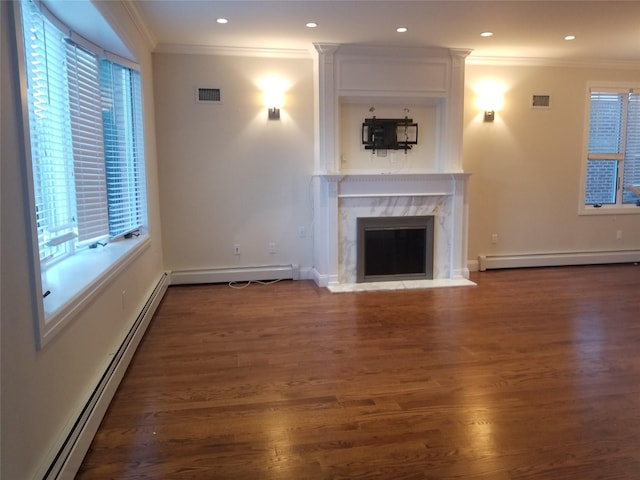 45-44 E 189th St, Flushing, NY 11368 - unfurnished living room featuring baseboard heating, crown molding, plenty of natural light, wood finished floors, and recessed lighting