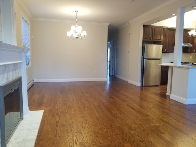 45-44 E 189th St, Flushing, NY 11368 - unfurnished living room with a chandelier, a premium fireplace, crown molding, wood finished floors, and a baseboard radiator