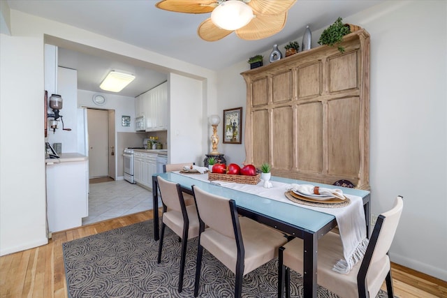 522 Shore Rd Unit 4Kk, Long Beach, NY 11561 - dining room with light wood-style floors and a ceiling fan