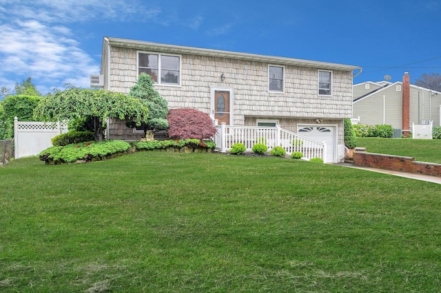 104 Cedarhurst Ave, Selden, NY 11784 - bi-level home featuring a garage