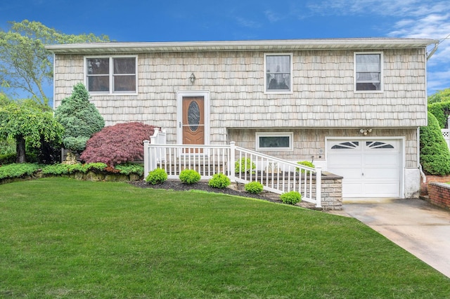 104 Cedarhurst Ave, Selden, NY 11784 - bi-level home with an attached garage, a front lawn, and concrete driveway