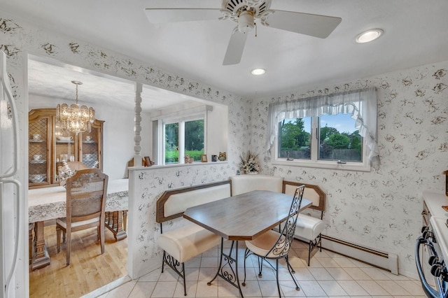 104 Cedarhurst Ave, Selden, NY 11784 - dining space with a baseboard radiator, a ceiling fan, wallpapered walls, a chandelier, and recessed lighting