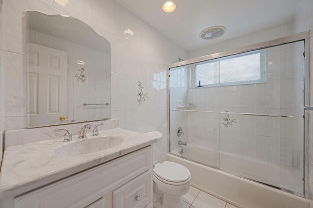 104 Cedarhurst Ave, Selden, NY 11784 - full bath featuring vanity, bath / shower combo with glass door, tile walls, and tile patterned floors