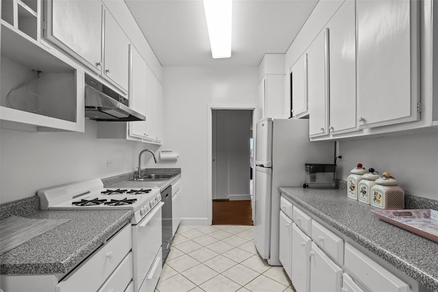 4455 Douglas Ave Unit 3Fe, Bronx, NY 10471 - kitchen with white appliances, under cabinet range hood, white cabinets, and light tile patterned floors