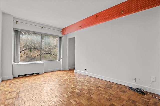 4455 Douglas Ave Unit 3Fe, Bronx, NY 10471 - spare room with baseboards and radiator