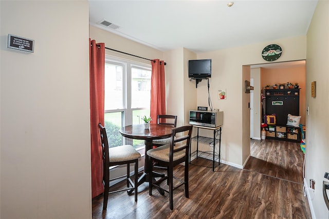 15 Juniper Ct Unit 15, Selden, NY 11784 - dining space with dark wood-style flooring and baseboards
