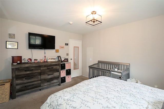 15 Juniper Ct Unit 15, Selden, NY 11784 - bedroom featuring dark colored carpet and a chandelier