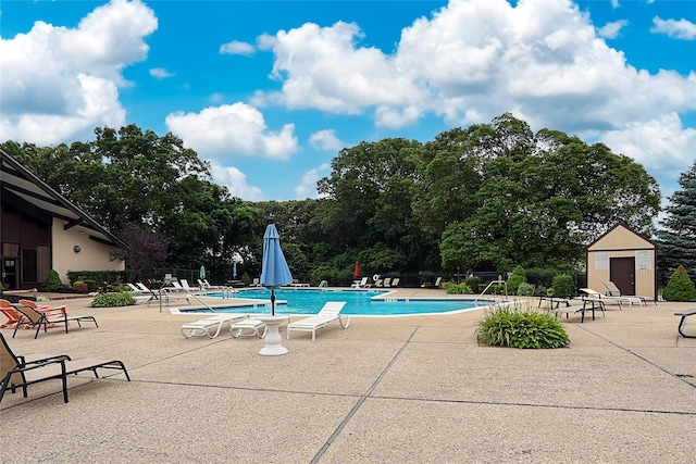 15 Juniper Ct Unit 15, Selden, NY 11784 - community pool with a patio and view of scattered trees
