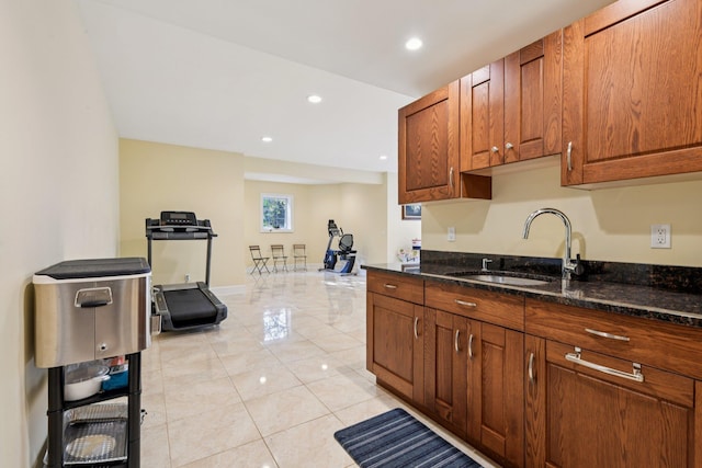 4 Celestial Ct, Saint James, NY 11780 - kitchen featuring dark stone countertops, recessed lighting, light tile patterned flooring, and brown cabinets