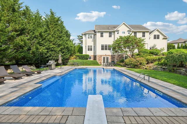 4 Celestial Ct, Saint James, NY 11780 - outdoor pool featuring a patio, a diving board, and french doors