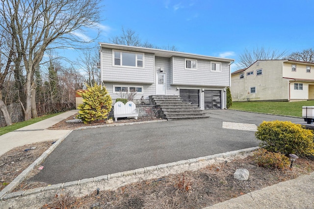 15 Bart Dr, Selden, NY 11784 - raised ranch featuring a garage and driveway