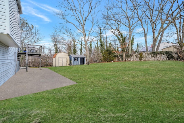 15 Bart Dr, Selden, NY 11784 - view of grassy yard with a storage unit and a patio