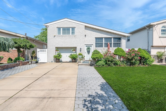 159-23 90th St, Howard Beach, NY 11414 - traditional-style home with brick siding, an attached garage, and concrete driveway