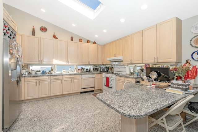 159-23 90th St, Howard Beach, NY 11414 - kitchen with white gas stove, stainless steel fridge with ice dispenser, a peninsula, under cabinet range hood, and a skylight