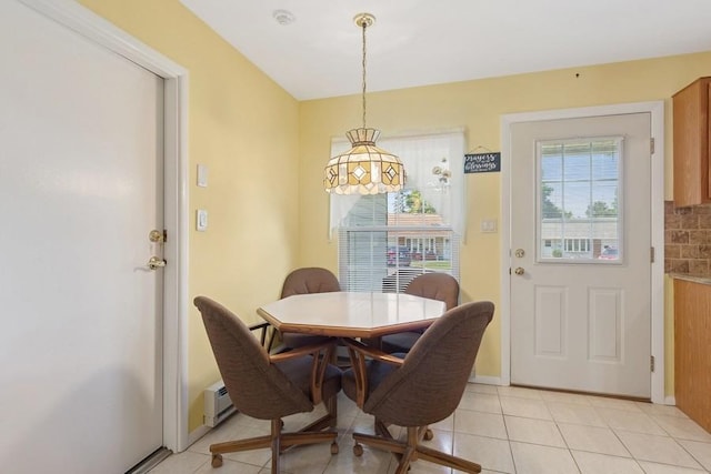 96 Enfield Ct Unit B, Ridge, NY 11961 - dining area with light tile patterned floors and baseboard heating