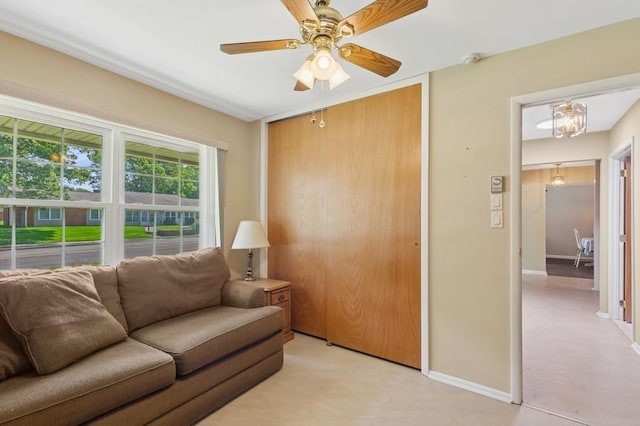 96 Enfield Ct Unit B, Ridge, NY 11961 - living room featuring baseboards and a ceiling fan