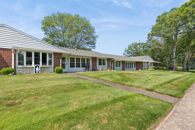 96 Enfield Ct Unit B, Ridge, NY 11961 - view of front of property with brick siding and a front yard