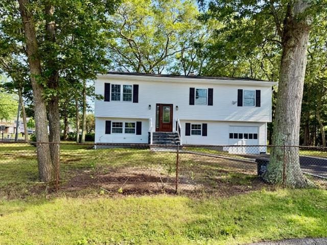 30 7th St, Holbrook, NY 11741 - raised ranch with an attached garage, entry steps, and asphalt driveway