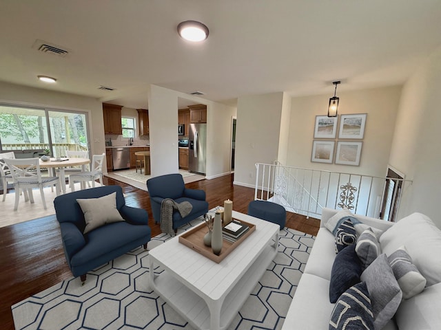 30 7th St, Holbrook, NY 11741 - living room with wood finished floors and baseboards