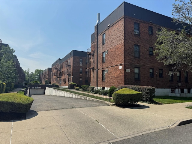 21528 47th Ave Unit 3B, Bayside, NY 11361 - view of property with driveway and a garage