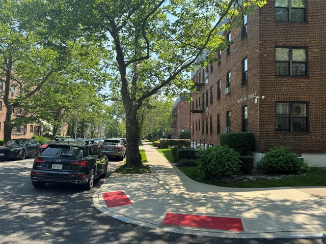 21528 47th Ave Unit 3B, Bayside, NY 11361 - view of asphalt road with sidewalks and curbs