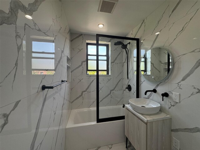 21528 47th Ave Unit 3B, Bayside, NY 11361 - bathroom featuring bathing tub / shower combination, vanity, and marble finish flooring