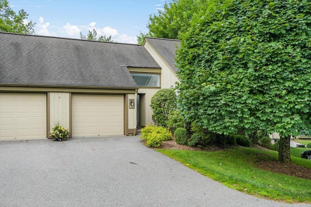 531 Heritage Hls Unit B, Somers, NY 10589 - view of front of home featuring a shingled roof, asphalt driveway, and an attached garage