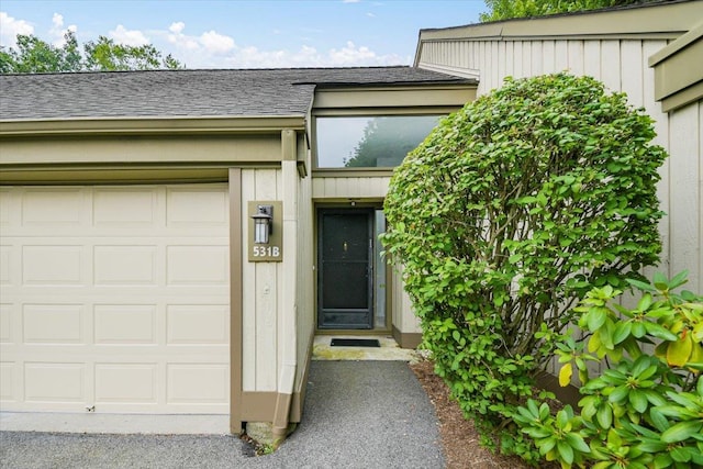 531 Heritage Hls Unit B, Somers, NY 10589 - doorway to property with a garage and roof with shingles