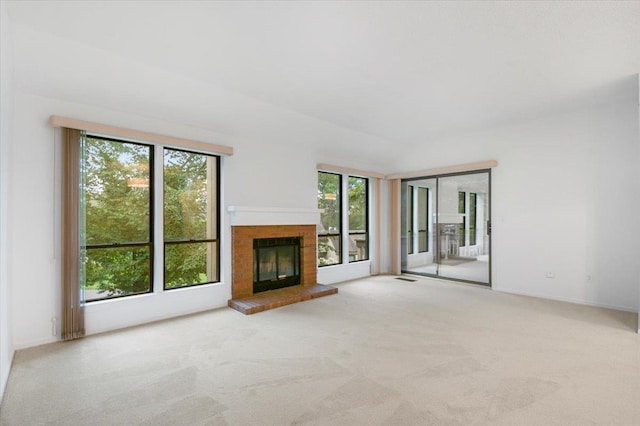 531 Heritage Hls Unit B, Somers, NY 10589 - unfurnished living room featuring healthy amount of natural light, carpet floors, and a fireplace