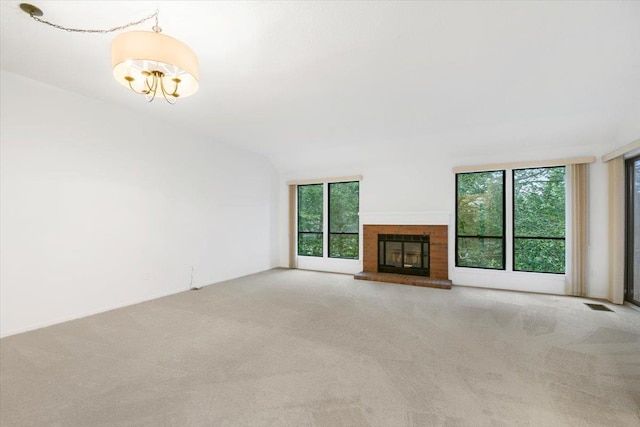 531 Heritage Hls Unit B, Somers, NY 10589 - unfurnished living room with carpet flooring, plenty of natural light, and a fireplace