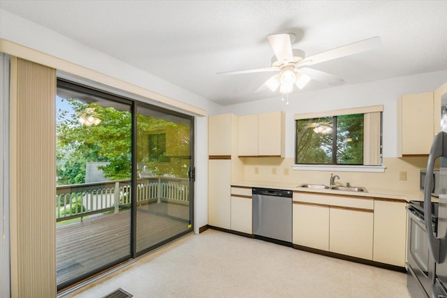 531 Heritage Hls Unit B, Somers, NY 10589 - kitchen featuring appliances with stainless steel finishes, cream cabinetry, light countertops, ceiling fan, and plenty of natural light