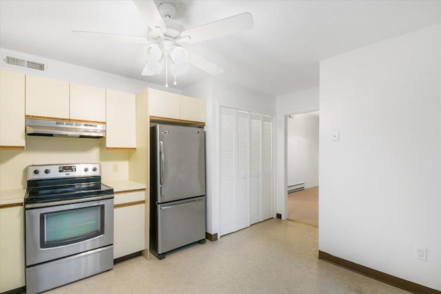 531 Heritage Hls Unit B, Somers, NY 10589 - kitchen featuring stainless steel appliances, under cabinet range hood, cream cabinets, light countertops, and a baseboard radiator
