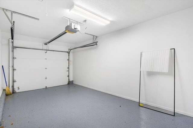 531 Heritage Hls Unit B, Somers, NY 10589 - garage featuring a garage door opener