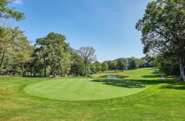 531 Heritage Hls Unit B, Somers, NY 10589 - surrounding community featuring view of scattered trees, view of golf course, a water view, and a yard