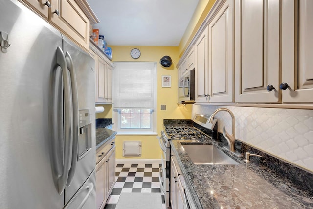 4 Park Ln Unit 4F, Mount Vernon, NY 10552 - kitchen with appliances with stainless steel finishes, dark floors, backsplash, and dark stone counters