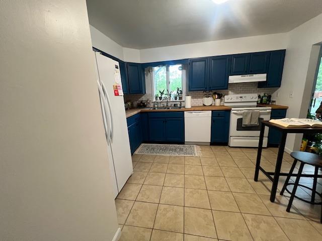 4 Meadow Ct, High Falls, NY 12440 - kitchen featuring white appliances, under cabinet range hood, blue cabinetry, and decorative backsplash