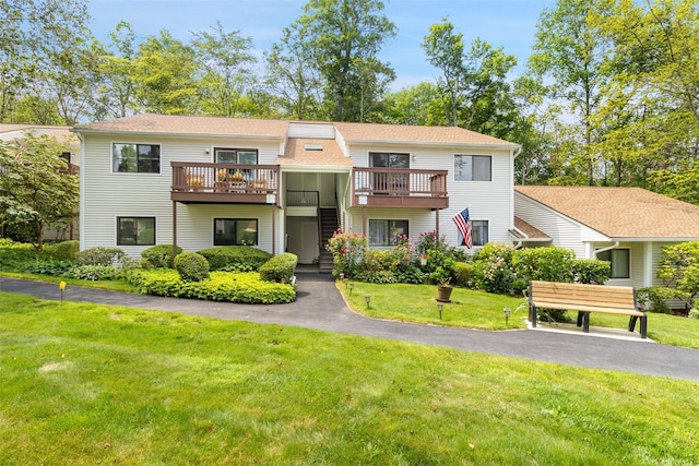 84 Molly Pitcher Ln Unit H, Yorktown Heights, NY 10598 - view of front of home featuring a front yard, stairway, a deck, and a shingled roof