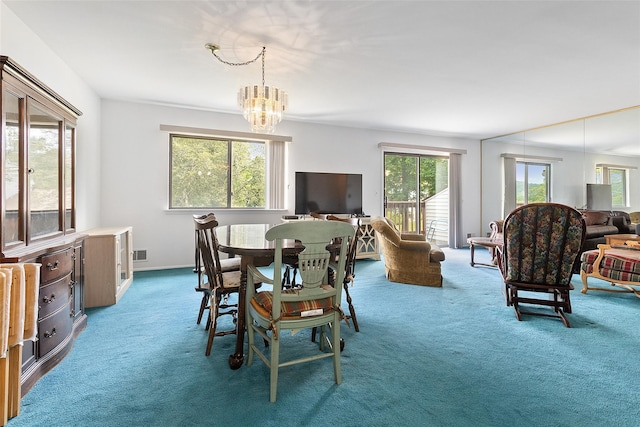 84 Molly Pitcher Ln Unit H, Yorktown Heights, NY 10598 - dining space featuring carpet and a chandelier