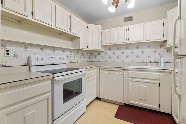 84 Molly Pitcher Ln Unit H, Yorktown Heights, NY 10598 - kitchen with white appliances, light countertops, and white cabinetry