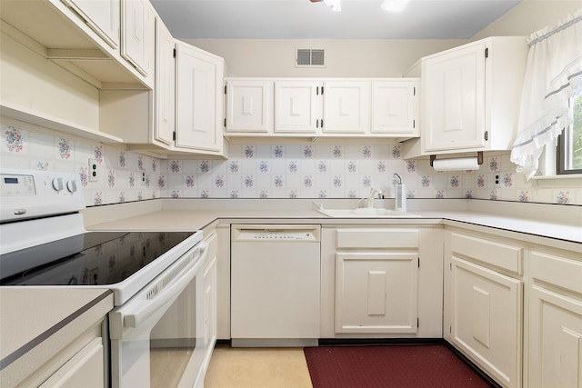 84 Molly Pitcher Ln Unit H, Yorktown Heights, NY 10598 - kitchen with white appliances, light countertops, and white cabinetry