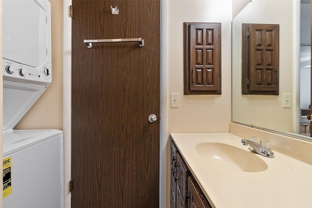 84 Molly Pitcher Ln Unit H, Yorktown Heights, NY 10598 - bathroom featuring stacked washer / drying machine and vanity