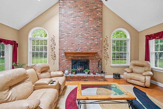24 Hampton Ct, Wallkill, NY 12589 - living room featuring high vaulted ceiling, wood finished floors, and a fireplace