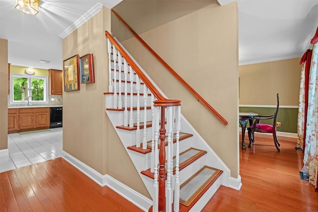 24 Hampton Ct, Wallkill, NY 12589 - staircase with wood finished floors and crown molding
