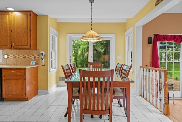 24 Hampton Ct, Wallkill, NY 12589 - dining area with plenty of natural light and light tile patterned floors