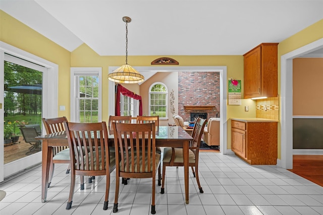 24 Hampton Ct, Wallkill, NY 12589 - dining area with healthy amount of natural light, a fireplace, and vaulted ceiling