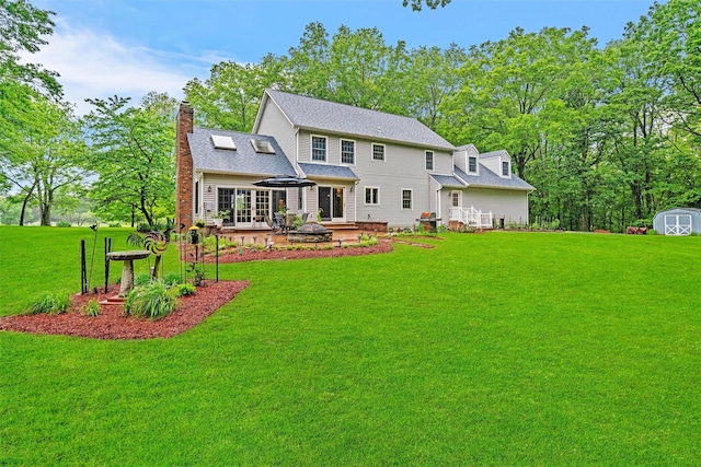 24 Hampton Ct, Wallkill, NY 12589 - rear view of house featuring a lawn, a shed, a chimney, a patio, and a shingled roof