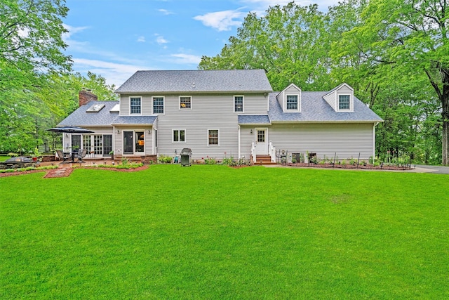 24 Hampton Ct, Wallkill, NY 12589 - view of front of home featuring entry steps, a front yard, roof with shingles, and a chimney